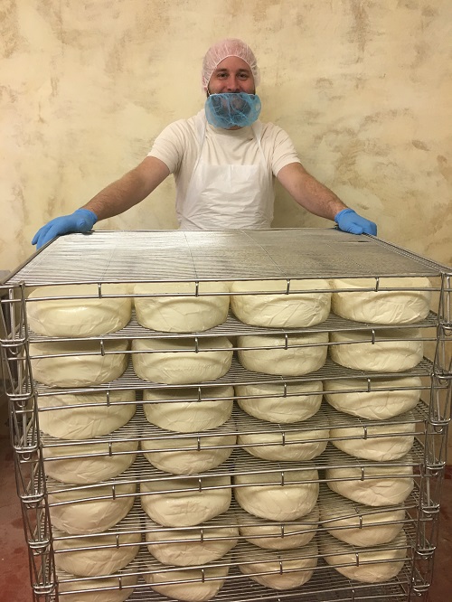 Bill in the cave at Bleu Mont Dairy with a batch of Wisconsin Tomme